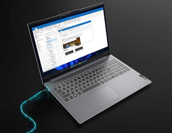 Left-facing IdeaPad Slim 5 Gen 8 laptop connected to a glowing charger cable on the left side USB-C port
