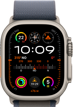 Apple Watch Ultra 2 associée à la Boucle Alpine bleu, affichant un cadran avec des complications dont le GPS, la température, la boussole, l'altitude et des données d'entraînement